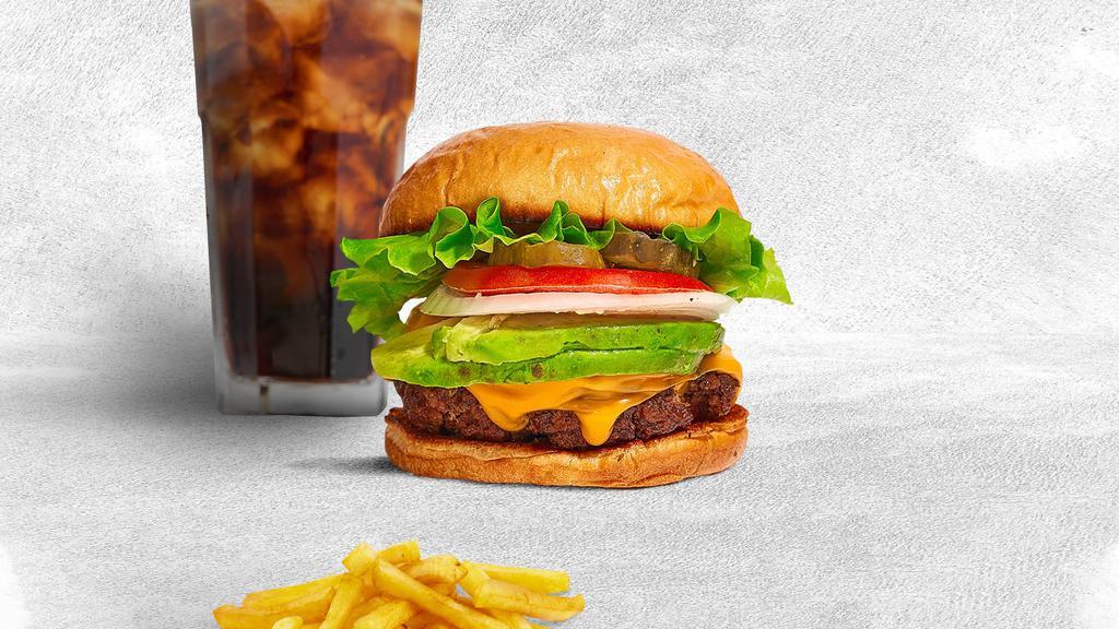 Bravocado Burger · American beef patty topped with avocado, melted cheese, lettuce, tomato, caramelized onion, chipotle remoulade and pickles. Served on a brioche bun.