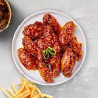Klassic Korean Wings · Fresh chicken wings fried until golden brown, and tossed in korean sauce, sesame seeds, scal...