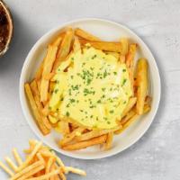 Cheesy Fries · Idaho potato fries cooked until golden brown and garnished with salt and melted cheddar chee...