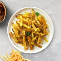 Garlic Geek Fries · Idaho potato fries cooked until golden brown and garnished with salt and garlic.