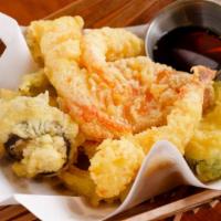 Tempura · Shrimp or veggies in light batter tempura served with light soy dipping sauce.