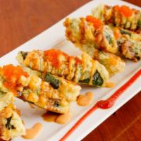 Jalapeño Bomb · Deep-fried jalepeño with spicy tuna and cream cheese inside with tobiko and sauce on top.