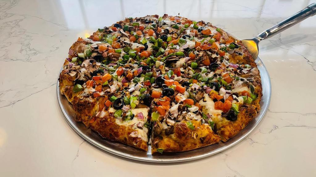 Curry Veggie Delight-Large · Organic Spicy Curry Sauce, Mozzarella Cheese, Mushrooms, Bell Peppers, Olives, Red Onions, Diced Tomatoes & Fresh Cilantro.