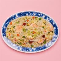 Shrimp Fried Rice · Wok fried rice tossed with shrimp, onions, mixed vegetables, and fried egg.