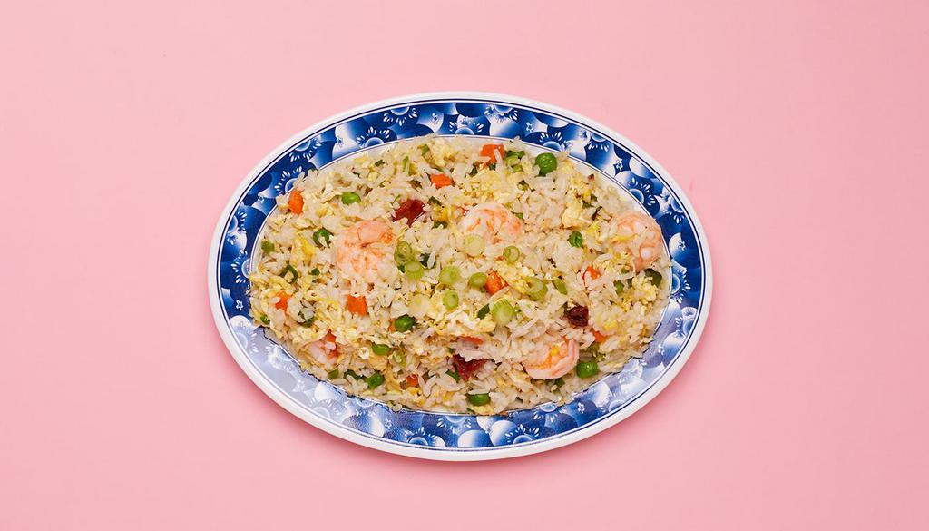 Pork Fried Rice · Wok fried rice tossed with pork, onions, mixed vegetables, and fried egg.