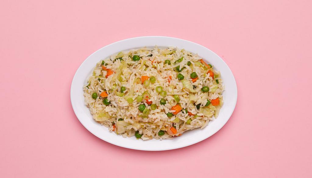 Vegan Fried Rice · Wok fried rice tossed with onions and mixed vegetables.