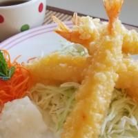 Tempura · Four pieces.Deep fried sweet shrimp wrapped in crunchy batter. Serves with home made 							...