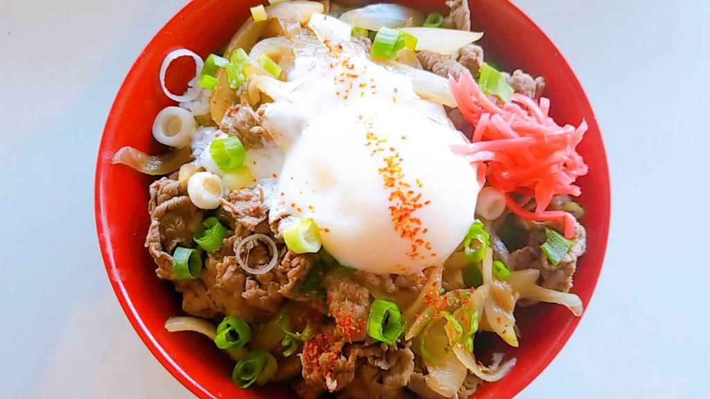 Gyudon · Thinly sliced Angus beef cooked in a homemade slightly sweet sauce topped with white onion, green onion, sesame seed, and pickled ginger. Serves over rice. [onsen egg add $2.5]
*contains fish, soy ,wheat*