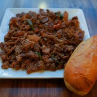 Tibsy Fitfit · Shredded injera, berbere, onions and Eritrean spice mixed with marinade beef.