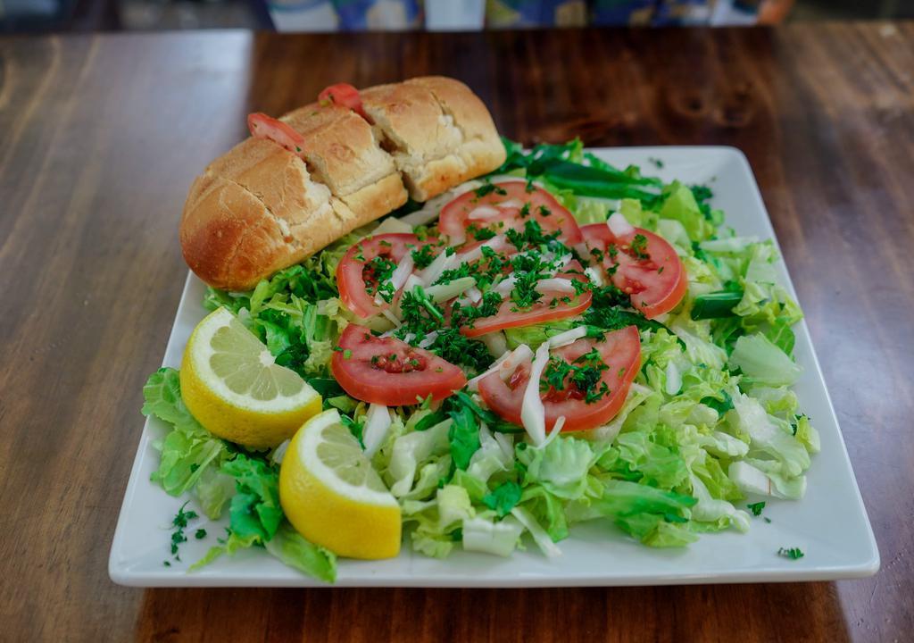 Adulis  special Salad · Lettuce, tomatoes, jalapeno  and onion tossed gently with the right amount of extra virgin olive oil, vinegar and special adulis herbs.