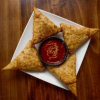 Samosas · Fried pastry with savory filling of potatoes, onions, peas, lentils with choice of beef, chi...