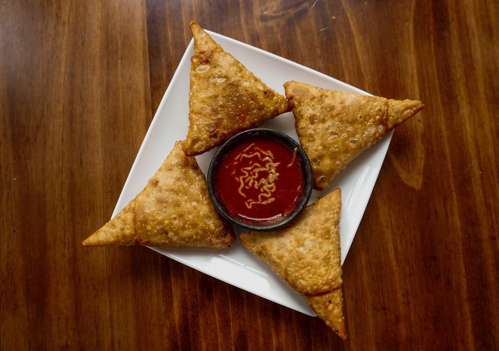 Samosas · Fried pastry with savory filling of potatoes, onions, peas, lentils with choice of beef, chicken or vegetables.
