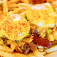Haystack · French fries topped with chopped bacon, green onions, poached eggs, and Hollandaise sauce.