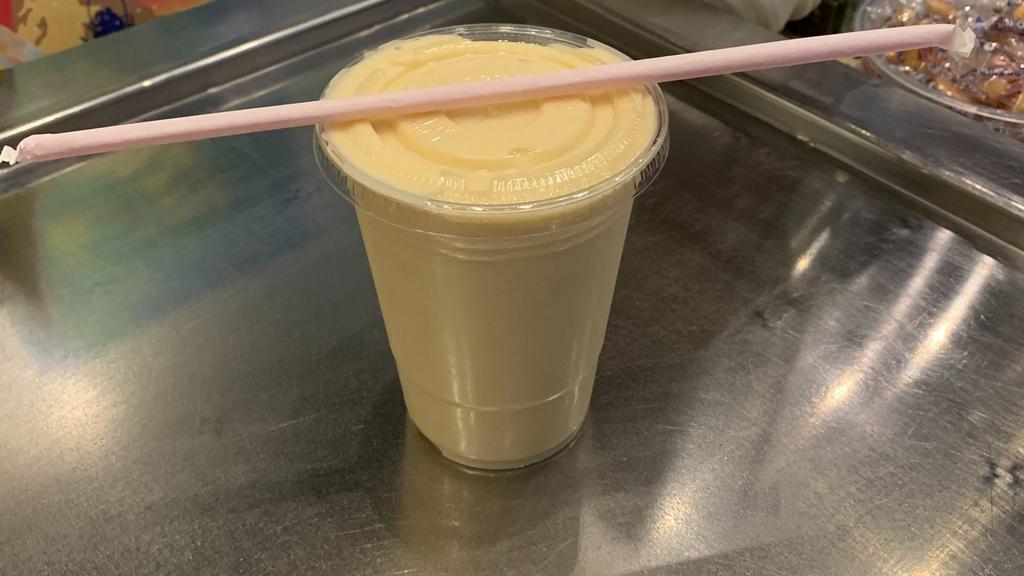 Passion Fruit Smoothie · Passion Fruit sherbet, condensed milk, sugar and milk blended into a smoothie.