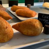 Coxinha · The staple Brazilian pastry. Filled with delicious creamy shredded chicken and cream cheese.