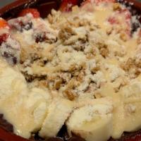 Gol D. Bowl · Topped with strawberries, bananas, granola, powdered milk, and condensed milk.