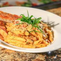 Cajun Pasta · Sautéed onions, sweet peppers, mushrooms, Cajun andouille sausage and chicken tossed with ou...