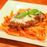 Chicken Parmigiana · Favorite. A large breaded chicken breast baked with mozzarella and marinara, served with cre...
