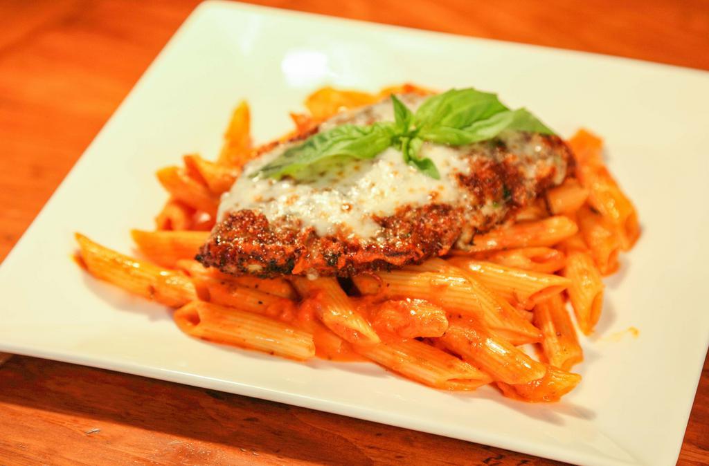 Chicken Parmigiana · Favorite. A large breaded chicken breast baked with mozzarella and marinara, served with creamy marinara penne pasta.