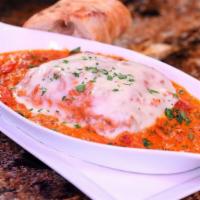 Classic Lasagna · Housemade lasagna with fontina, mozzarella & parmesan cheese bolognese & creamy bechamel.