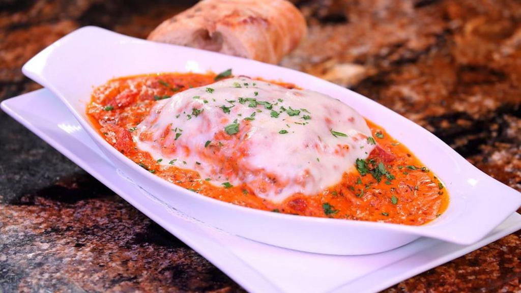 Classic Lasagna · Housemade lasagna layered with fontina, mozzarella, and Parmesan cheese our bolognese sauce and creamy bechamel.