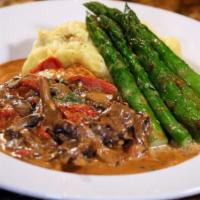Chicken Marsala · Lightly breaded chicken breast sautéed with mushrooms and plum tomatoes in a marsala wine sa...
