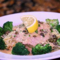 Chicken Piccata · Lightly breaded chicken breast sautéed in a white wine sauce with capers on capellini pasta
