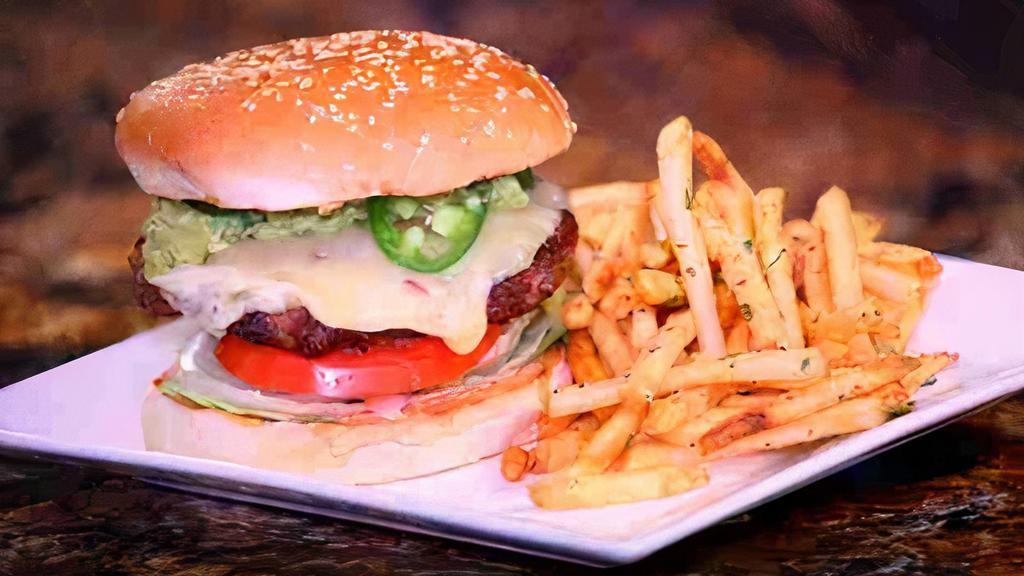 South of the Border  Cheeseburger · A half a pound certified Angus beef topped with pepper jack cheese, jalapenos, homemade spicy guacamole, and garnished with lettuce, tomato, onion, with our 1000 island dressing on a sesame seed bun.