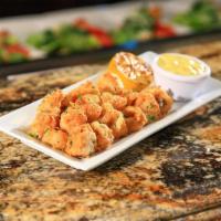 Calamari Fritti · Golden fried calamari served with lemon aioli and marinara sauce.