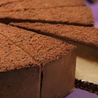 CHOCOLATE GANACHE CHEESECAKE · A Slice of New York style cheesecake topped with a thick, rich layer of chocolate ganache.