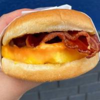 Brioche Breakfast Sandwich · Egg, smoked bacon, melted cheddar cheese and garlic Butter