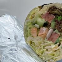 Falafel Wrap · Vegetarian. Fresh falafels wrapped with Mediterranean salad, lettuce and tahini sauce.