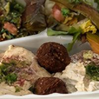 Combo Plate · Vegetarian. Hummus, falafels, tabouleh, baba ghanoush, salad, dolma, and pita bread.
