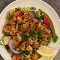 Chicken Shawarma Salad · Our House marinated Chicken shawarma on top of our house salad