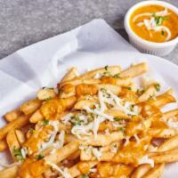 Garlic Tikka Fries · Vegetarian. Potato fries tossed w/minced garlic, Parmesan cheese & onions in a tikka sauce d...