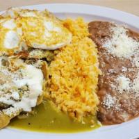 Chilaquiles · Fried tortillas bathed in green  salsa   green tomatillo sauce is with topped  a egg,  chees...