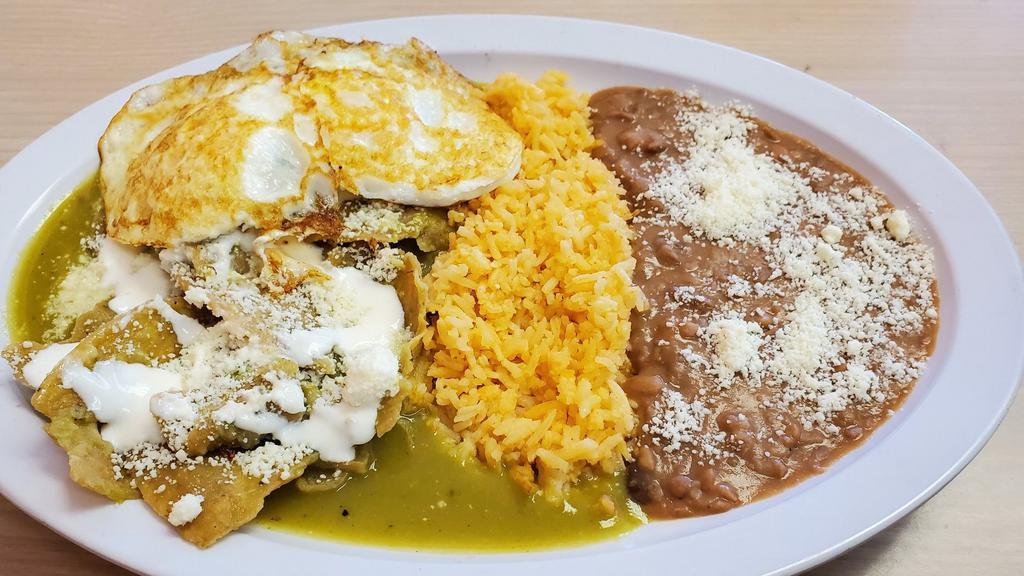 Chilaquiles · Fried tortillas bathed in green  salsa   green tomatillo sauce is with topped  a egg,  cheese,rice, beans.
