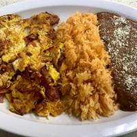 Huevos con Jamon · Scrambled eggs with ham served with  rice , refried Beans , corn tortillas handmade.