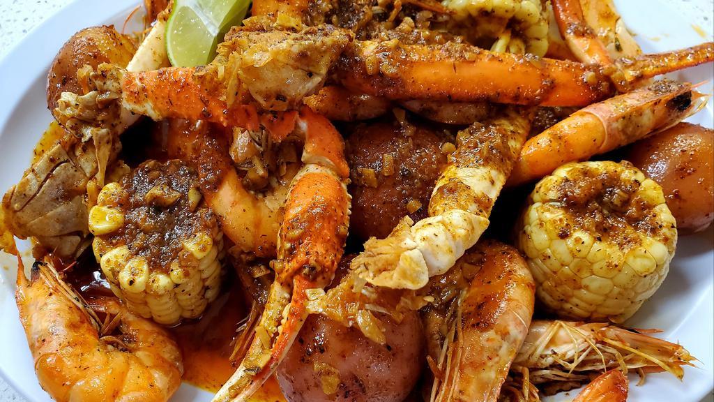 Boiling Crab · Shrimp,  crab leg, potatoes, corn, bread , marinated with house salsa  .