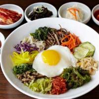 The Works Bibimbop · A bed of rice topped with spinach, mushroom, radish, julienned carrots, bean sprouts, quinoa...