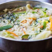 Korean Noodle Soup · Thick flour noodle soup with vegetables, scallions, and egg. The broth is made with kelp and...