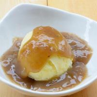 Mashed Potatoes & Gravy · A comfort staple. Creamy mashed potatoes with our rich, thick gravy.
