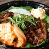 Yakiniku Don · Sliced BBQ beef, kimchi, and soft boiled egg over rice.