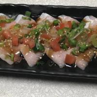 Hamachi Jalapeno Carpaccio · sliced raw yellow tail sashimi, sliced jalapeno, onions, original dressing