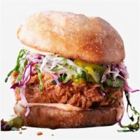 Spicy Fried Chicken Sandwich · Fried chicken made spicy and served on a toasted bun, topped with coleslaw, and spicy mayonn...