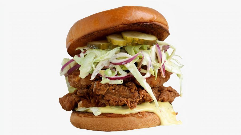 Ol' Faithful Fried Chicken Sandwich · Fried chicken served on a toasted bun and topped with coleslaw, pickles, and mayonnaise.