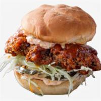 Korean Fried Chicken Sandwich · Fried chicken served on a toasted bun and topped with kimchi and spicy mayonnaise.