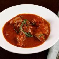 Lamb Curry · Boneless lamb curry cooked with tomato onion sauce and special blend of species.
