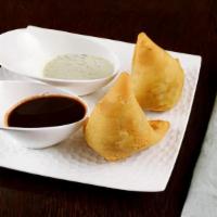 Samosa · 2 pieces per order. A samosa is a fried pastry with a savory filling, such as spiced potatoe...