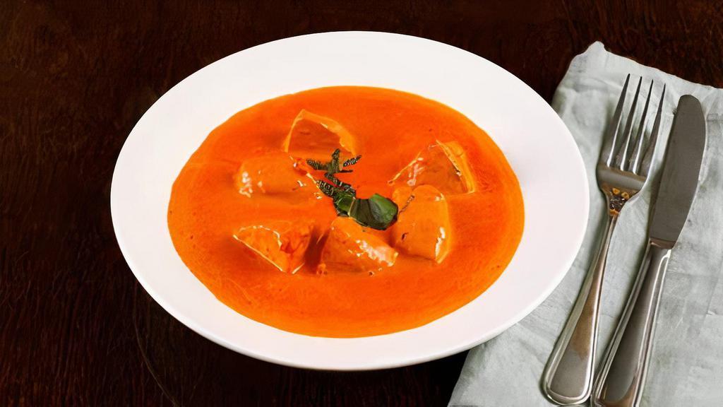 Chicken Tikka Masala · boneless chicken breast cooked in a creamy tomato sauce and spices.